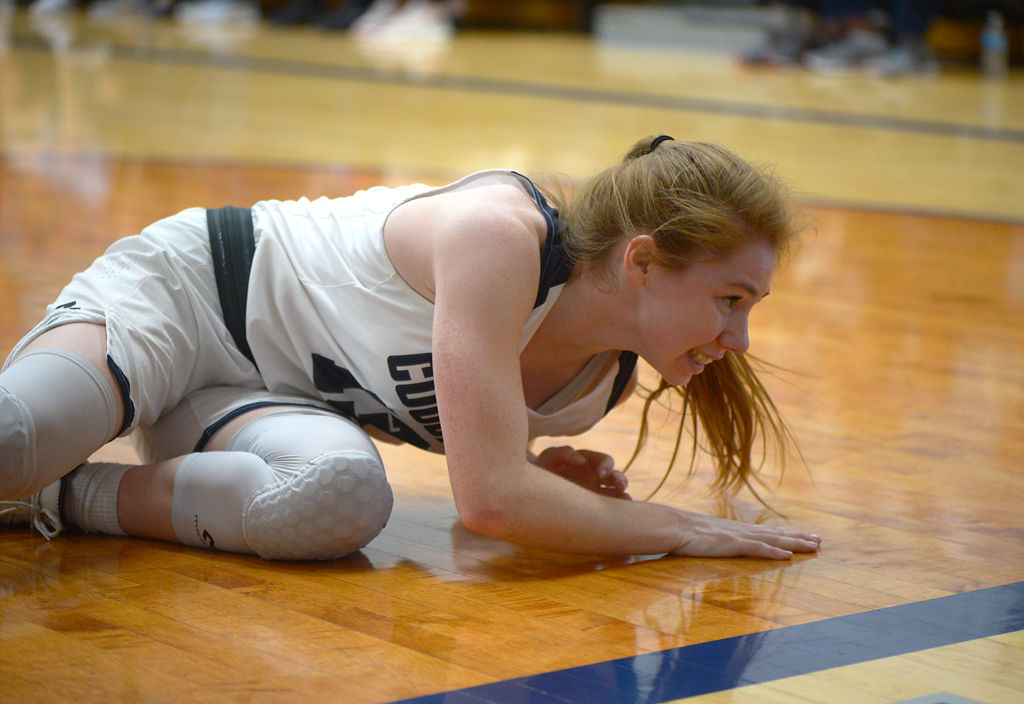 Bria Jones starts to get up off the court after falling for